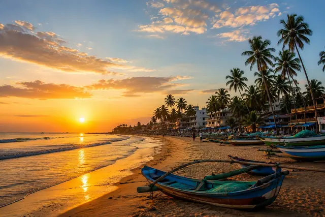 Negombo beach at golden hour with fishing boats and palm trees